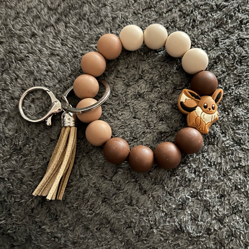 Hand Crafted Brown, Tan & Cream Beaded Keyring with Tassel and Eevee Charm